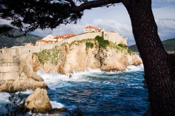 "Proud Dubrovnik" travel photography by Nat Coalson. The city of Dubrovnik, known throughout the ages as Ragusa, is on the Dalmatian Coast of Croatia. Founded in the 13th century, the city was an important Mediterranean sea power for centuries. The Old Town is encircled by a high stone wall with many defensive and lookout towers. Dubrovnik is a well-preserved example of a late-medieval walled city and the Old Town is a UNESCO World Heritage Site. Prints available, for details please click the Purchase link above.