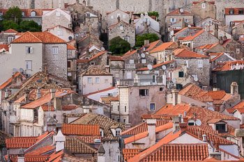 Scenic photograph of the Old Town in Dubrovnik, Croatia shows the compact buildings and rooftops.