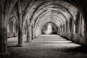 Fountains Abbey, near Ripon, England, was founded in 1132. It was in use for over 400 years and is one of the best preserved Cistercian monasteries in England. This photograph was made inside the Great Cloister, which physically and symboically separated the world of the monks living at the abbey apart from the outside world. Prints available, please click the Purchase link for details.