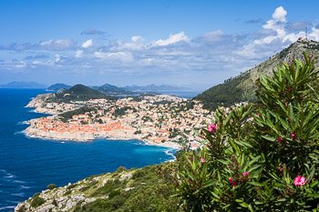 View of Dubrovnik, Croatia from above on a bright, spring morning. The city of Dubrovnik, known throughout the ages as Ragusa, is on the Dalmatian Coast of Croatia. Founded in the 13th century, the city was an important Mediterranean sea power for centuries. The Old Town is encircled by a high stone wall with many defensive and lookout towers. Dubrovnik is a well-preserved example of a late-medieval walled city and the Old Town is a UNESCO World Heritage Site. Prints available, for details please click the Purchase link above.