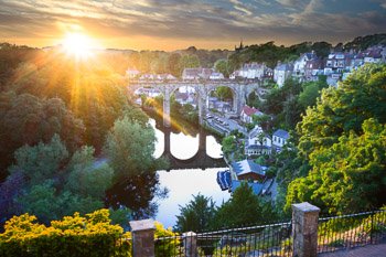 Viewed from the ruins of Knaresborough Castle, the last rays of the setting sun streak over this quintessential English village. The town's railway viaduct, completed in 1851, is on the Harrogate Line between Leeds and York and traverses the River Nidd. Prints are available; for details, click the Purchase link above.