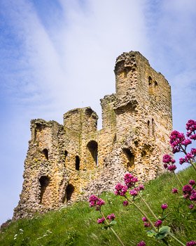 Scarborough Castle is a former medieval Royal fortress on a rocky promontory overlooking the North Sea in North Yorkshire, England. The entire west wall, roof, and interior floors of the castle's keep were destroyed in 1645 by artillery bombardment during the English Civil War. Prints available; for details click the Purchase link above.